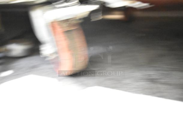 Image is blurred; unable to discern details of the Perlick DS60BLT stainless steel kegerator.