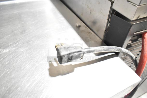 Perlick DS60BLT stainless steel kegerator, 115V, shown with power cord plug.