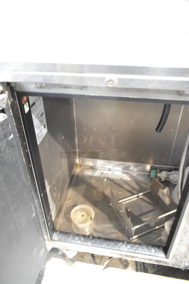 Perlick DS60BLT stainless steel kegerator interior, showing open space and fittings. Labels indicate 115 volts, 1 phase power.
