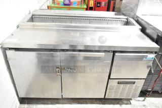 Continental CPA60 stainless steel commercial prep table on casters, 115V, 1 phase, moderate wear, storage compartments visible.