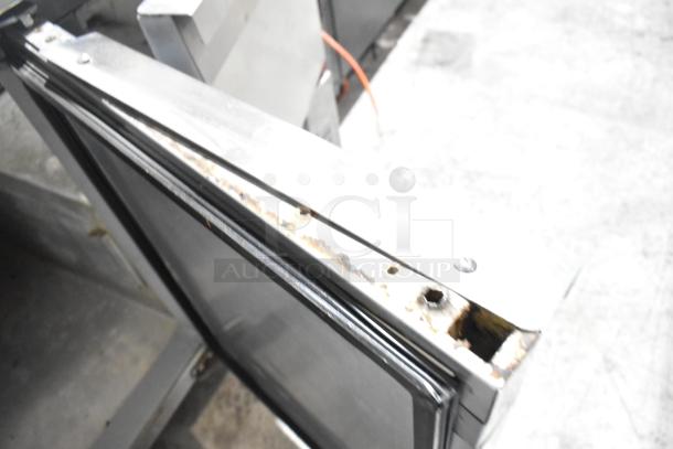 Continental CPA60 stainless steel commercial prep table, visible rust on door edge, on casters, 115V, 1 Phase.