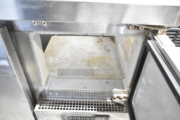 Continental CPA60 stainless steel commercial prep table, used condition, on commercial casters. Model tag visible. 115V, 1 phase.