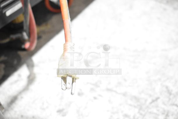 Alt text: Close-up of a power plug connected to a Continental CPA60 commercial prep table.