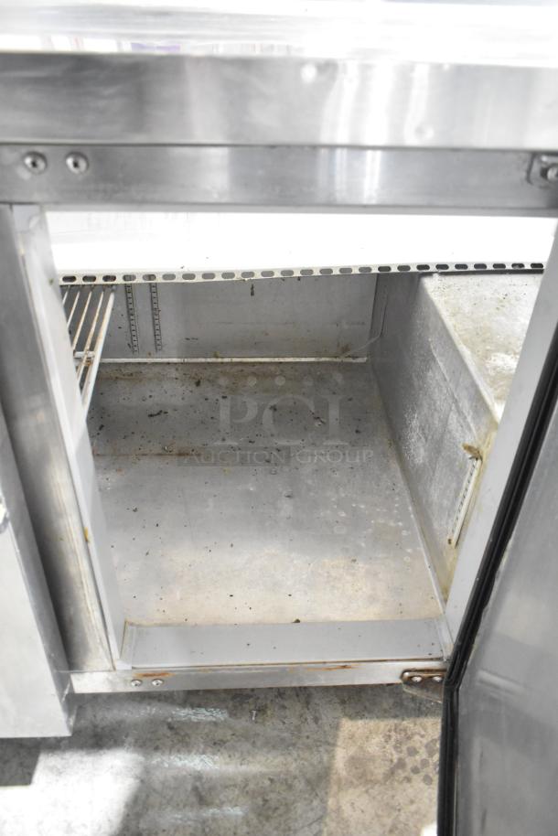 Continental CPA60 stainless steel prep table with open storage, commercial casters, 115 volts, visible wear, model CPA60.