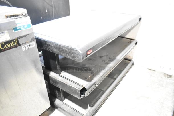 Hatco GR2SDH-36D metal commercial countertop merchandiser with double shelves, visible wear, and Hatco logo label.