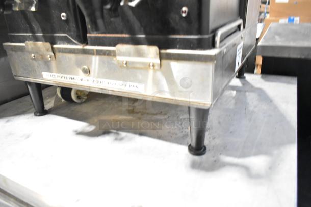 2016 Bunn DUAL SH stainless steel commercial double coffee machine base, shows slight wear; label advises placing pan under spout.