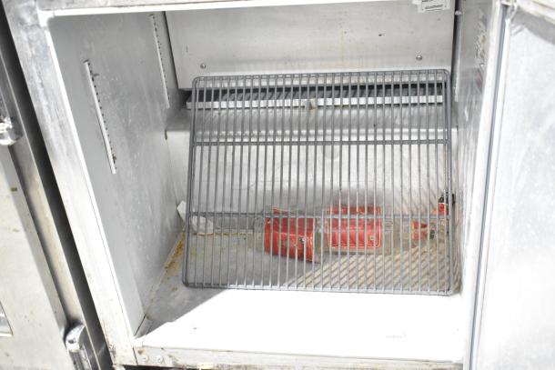 Continental UR27 stainless steel undercounter cooler, single door, commercial casters, 115V, 1 phase, interior shelf visible.