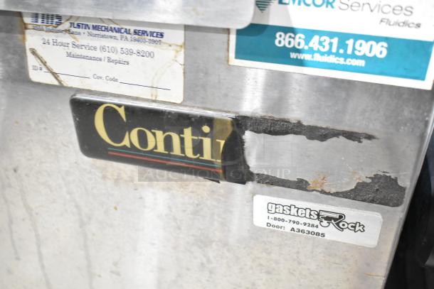 Continental UR27 stainless steel single door undercounter cooler with casters, visible wear, maintenance stickers, 115V, 1 phase.