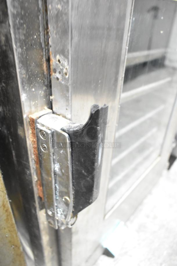 Alto Shaam 1000-UP/P stainless steel proofing cabinet, showing hinge detail and rust. 8 pan capacity, window doors.