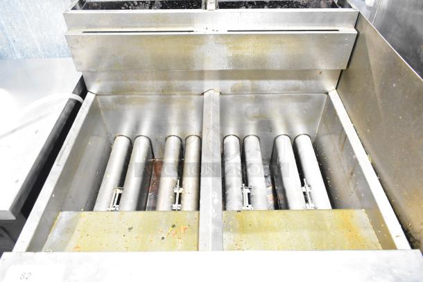 Dean SCFHD250GNC stainless steel 2-bay deep fat fryer, natural gas, 100,000 BTU, showing interior burners, lightly used.