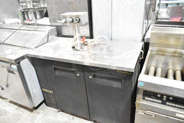 True TDB-24-48 metal kegerator with beer tower; black exterior; dual doors; 115V, 1 phase; used condition.