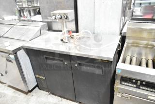 True TDB-24-48 metal kegerator with beer tower; black exterior; dual doors; 115V, 1 phase; used condition.
