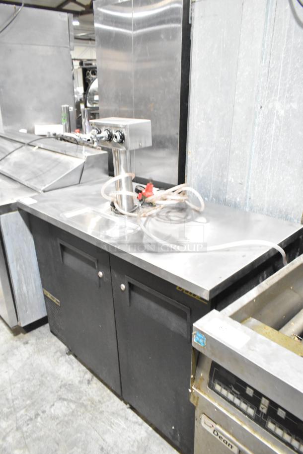 True TDB-24-48 metal kegerator with beer tower, 115 volts, 1 phase, good condition, commercial use, sturdy design.