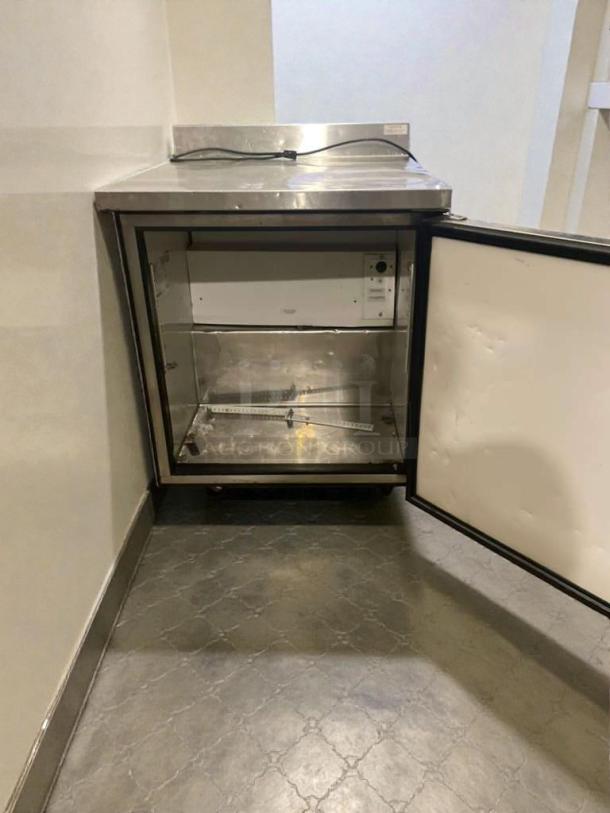 True TWT-27F undercounter freezer, premium condition, fully tested. Stainless steel finish, open door interior view.