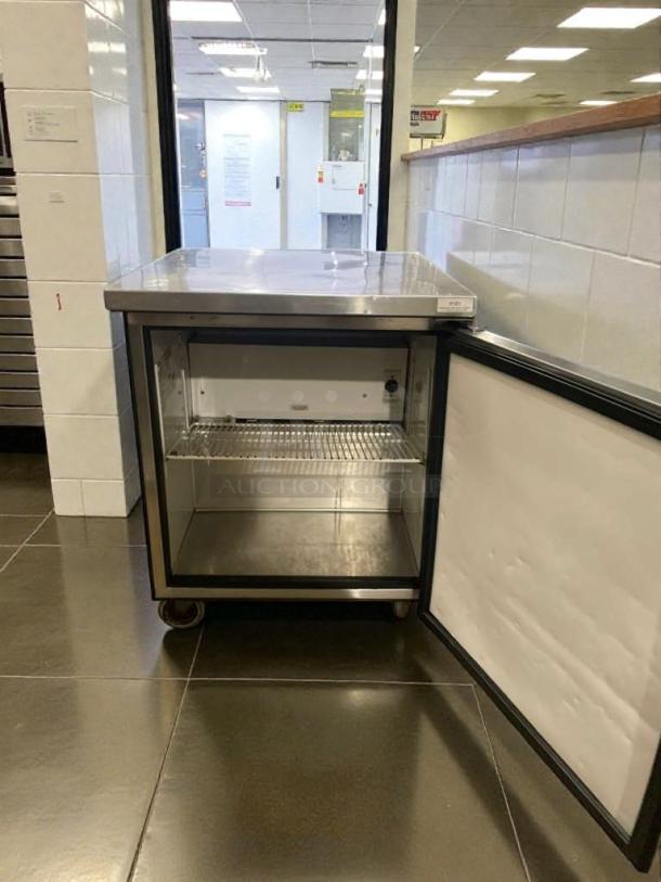 True TUC-27-LP undercounter refrigerator, stainless steel, hinged door open, tested, working condition, 115V, single phase.