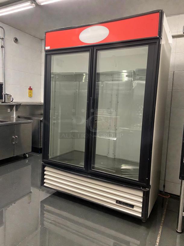 True GDM-49 glass door merchandiser, premium condition, 115V, single phase, black frame, fully tested, by True Manufacturing.
