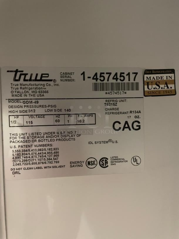 True GDM-49 Commercial Glass Door Merchandiser label detailing model info, voltage (115V), refrigerant (R134A), and certifications.