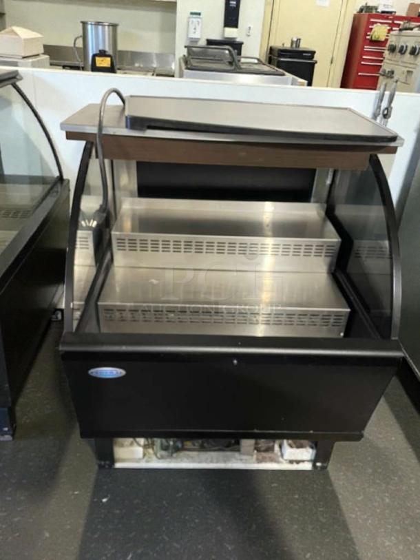 The C. Schmidt EHD-4 refrigerated display merchandiser in excellent condition, 115V single phase, fully tested and working.