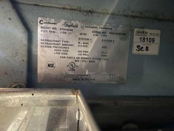 Delfield STD464N tag shows 115V, 60Hz, R-404A refrigerant, tested, NSF and UL listed, made in USA.