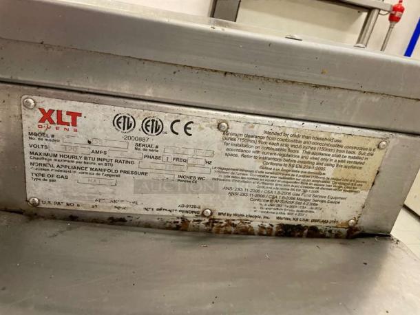 Like-new XLT Conveyor Pizza Oven, model XLT-L-OVEN-0154. Natural gas, fully tested and working. Label shows voltage and specs.
