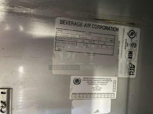 Beverage-Air UCR27A label showing model, refrigerant, electrical ratings, and warranty contact details.