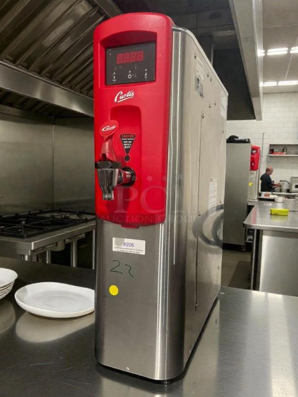 Wilbur Curtis WB5N coffee brewer, stainless steel and red finish, excellent condition, model label CUR-L-BRW-0165 visible.