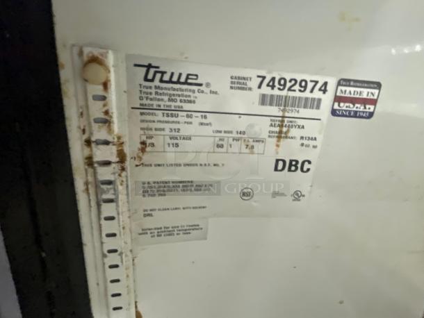 True TSSU-60-16 Refrigerator label showing model details, serial number 7492974, voltage 115V, and refrigerant type R134A.