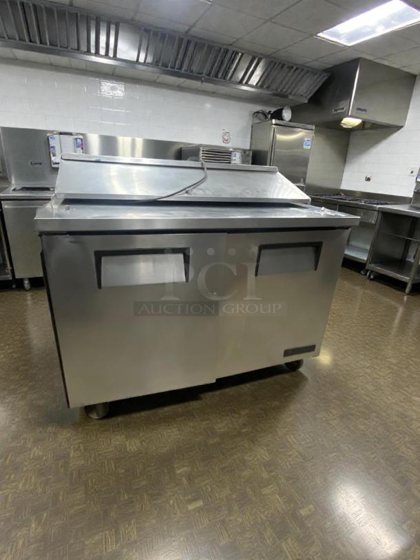 True TSSU-48-12 refrigerated prep table in superior condition, stainless steel, fully tested, 115V, single phase.