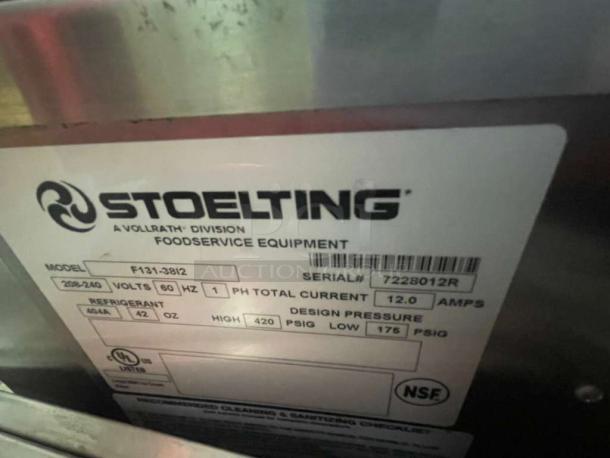 Stoelting F131-3812 soft serve machine label showing model, 208-240V, single phase, 12A, NSF certified.