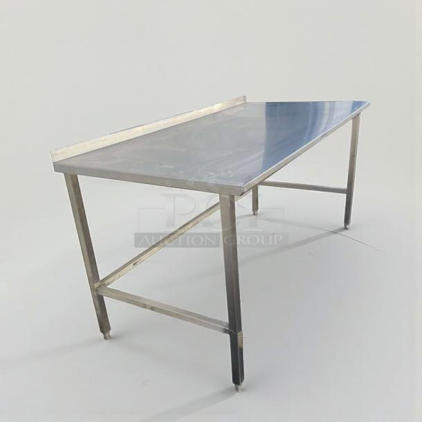 High-grade stainless steel commercial work table, 72", with backsplash. Inspected, excellent condition, model SS-S-TBL-0184.