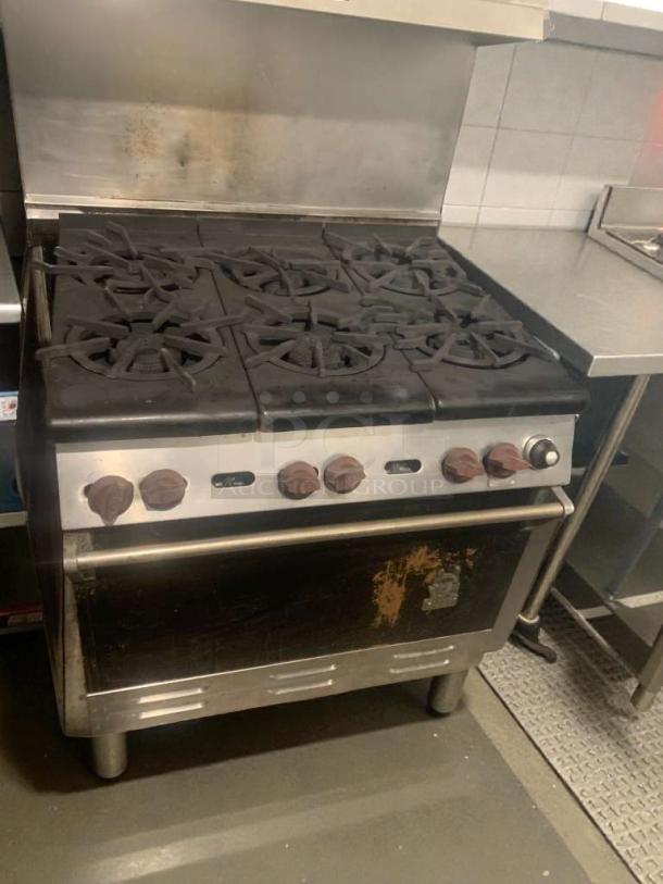 Commercial 6-burner gas range with oven, model COM-L-RNG-187, refined condition, fully tested, stainless steel exterior.