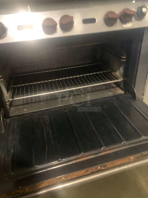 Commercial 6-burner gas range with oven, fully tested, generic brand, model COM-L-RNG-187, in refined condition.