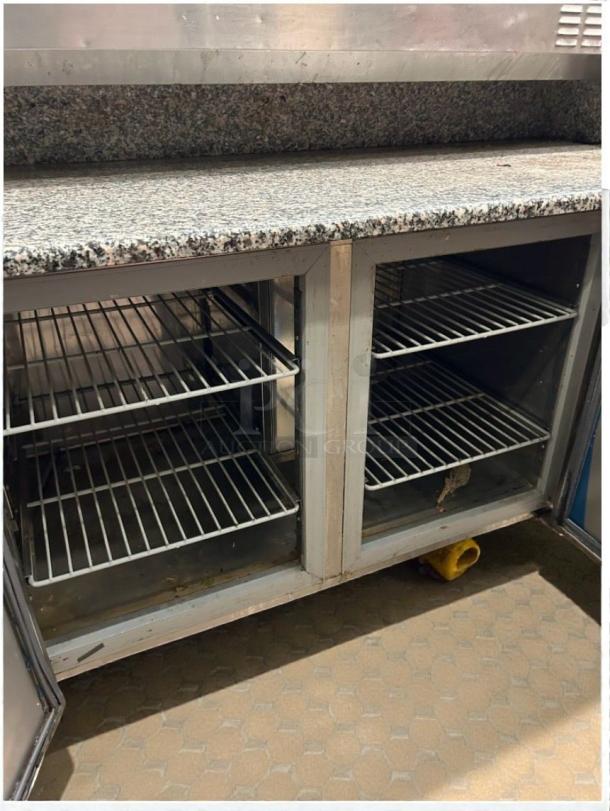 Marra Forni 87″ commercial prep table in top-tier condition, granite top, dual storage compartments, tested and fully working.