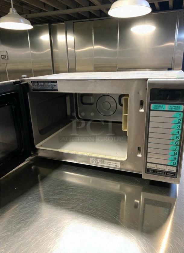 Sharp R-21LVF commercial microwave in superior condition, 120V/single phase. Fully tested, functional with control panel visible.