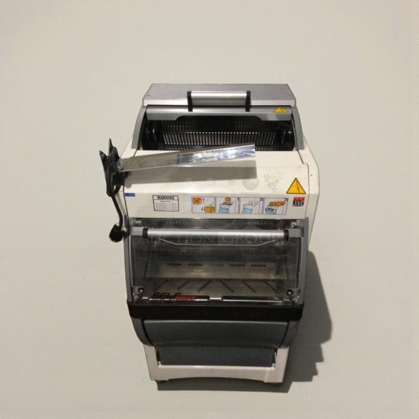 JAC KG-12FS Commercial Bread Slicer, refined condition, 115V, tested, with safety labels and instructional illustrations visible.