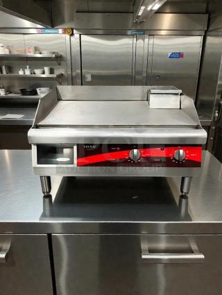 Avantco 177EG24N 24" commercial electric griddle in top condition, 208-240V single phase, features controls and clean surface.