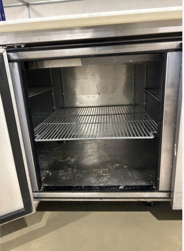 True TPP-93 refrigerated prep table, stainless steel interior, premium condition, fully tested, 115V, commercial use.