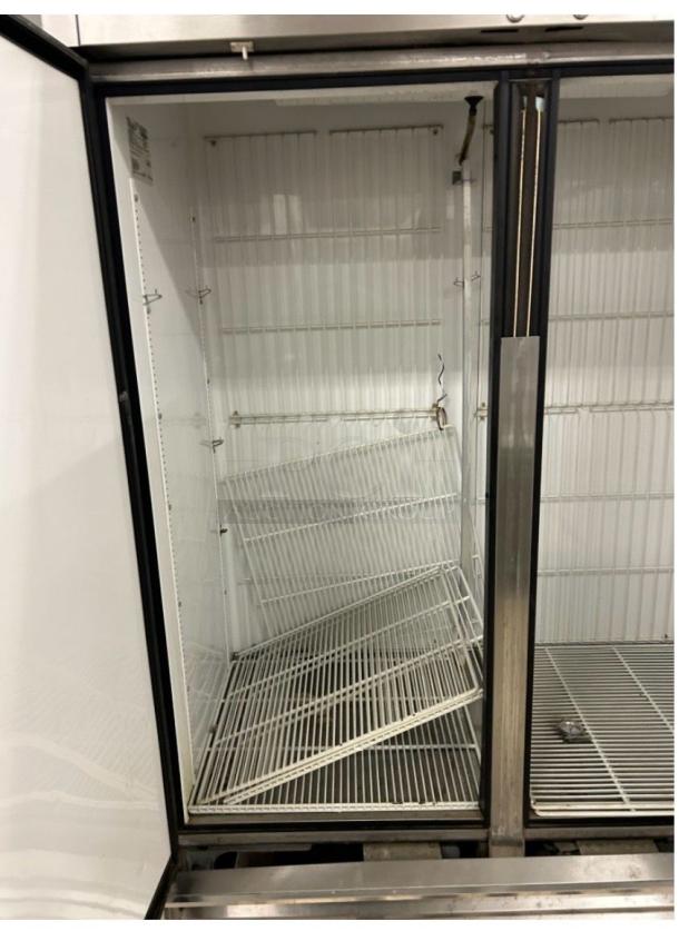 True T-49F commercial reach-in freezer, excellent condition, fully tested, 115V, double doors, interior shelves visible.