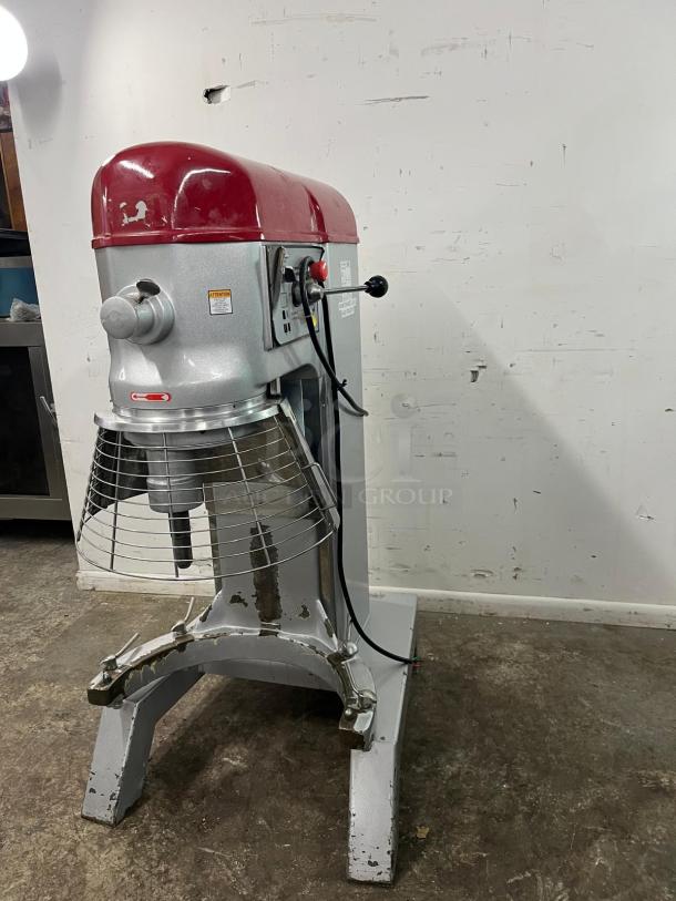 AXIS AX-M80 planetary mixer, 80QT capacity, red and silver finish, protective cage, sturdy base, visible wear, industrial use.