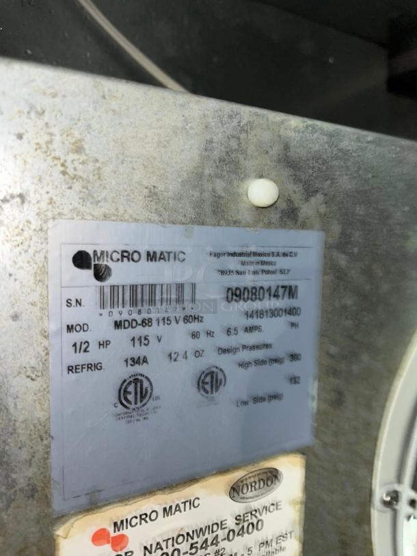 Label on Micro Matic MDD68-E draft beer cooler showing model, specs, and service info for commercial use.