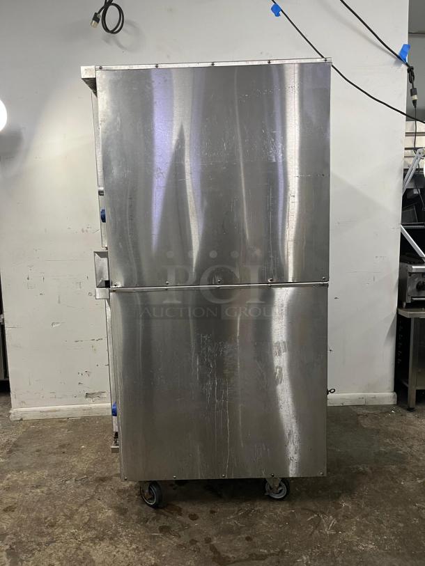 IMPERIAL Double-Deck Convection Oven, stainless steel, reliable performance, used condition, on casters for mobility.