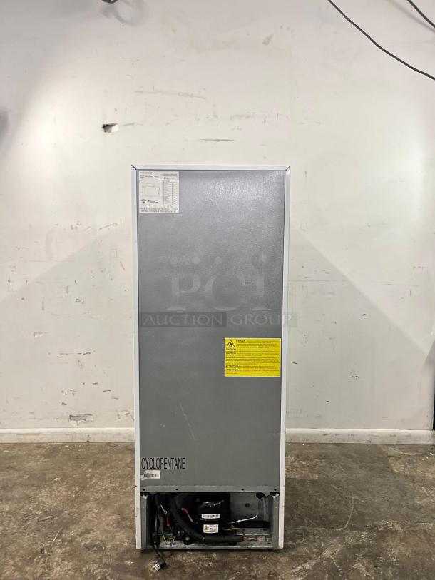 Insignia 7 Cu. Ft. Convertible Freezer, model NS-UZ70WH4, energy-efficient, multitask as freezer or fridge, rear view.