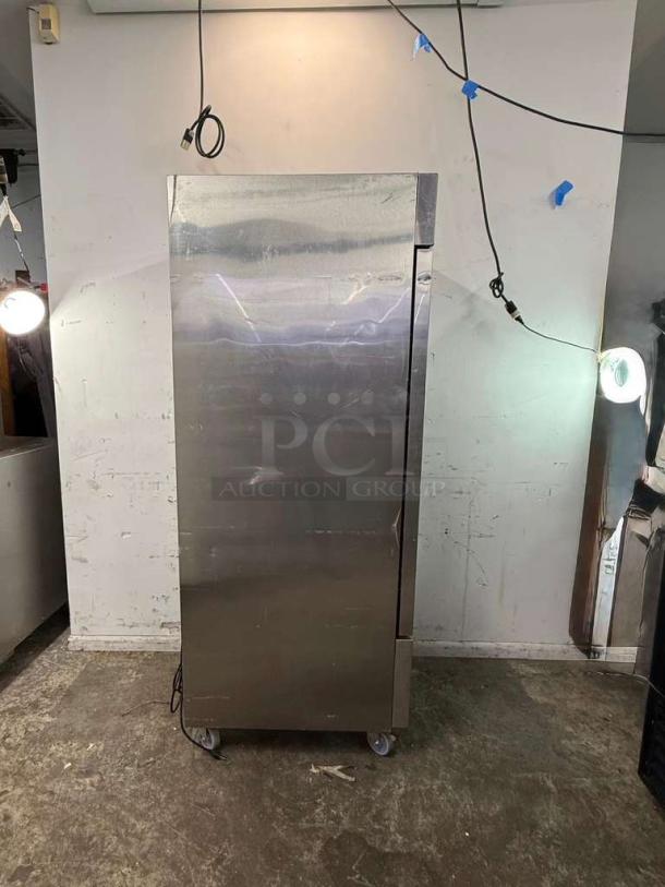 DUKERS D28R single-door commercial reach-in refrigerator, stainless steel, on casters, some visible wear.