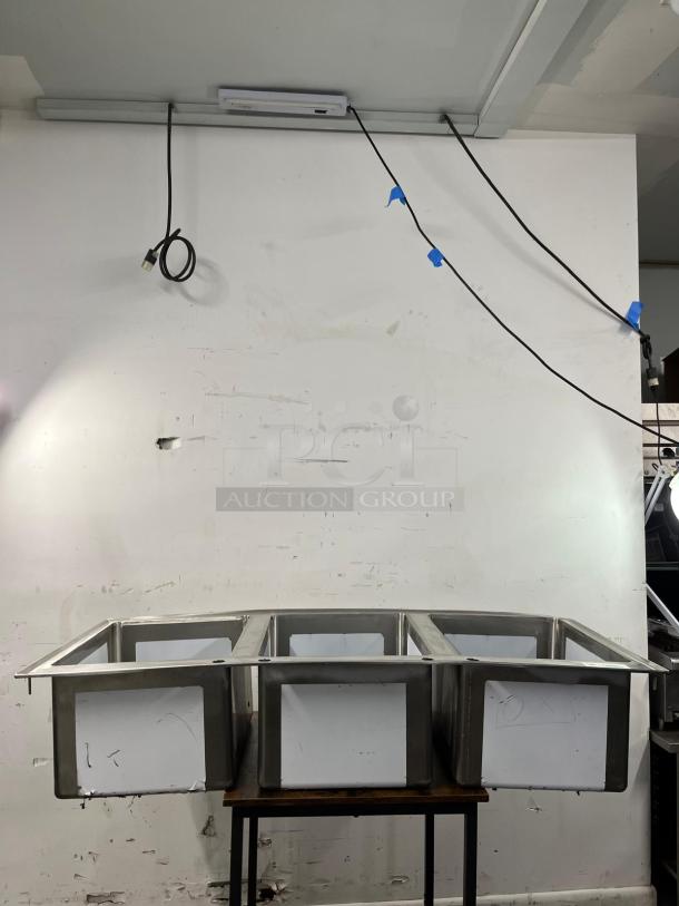 BRAND NEW Regency 16-Gauge Stainless Steel Three Compartment Drop-In Sink, model 600DI31612, pristine condition.