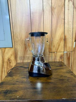 Oster Pro 500 blender with glass jar and brushed nickel base, in used condition.