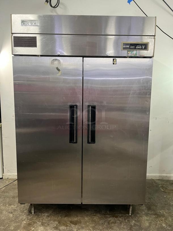 Green World GST-40DR commercial reach-in refrigerator, 2 solid doors, stainless steel, visible control panel, good condition.