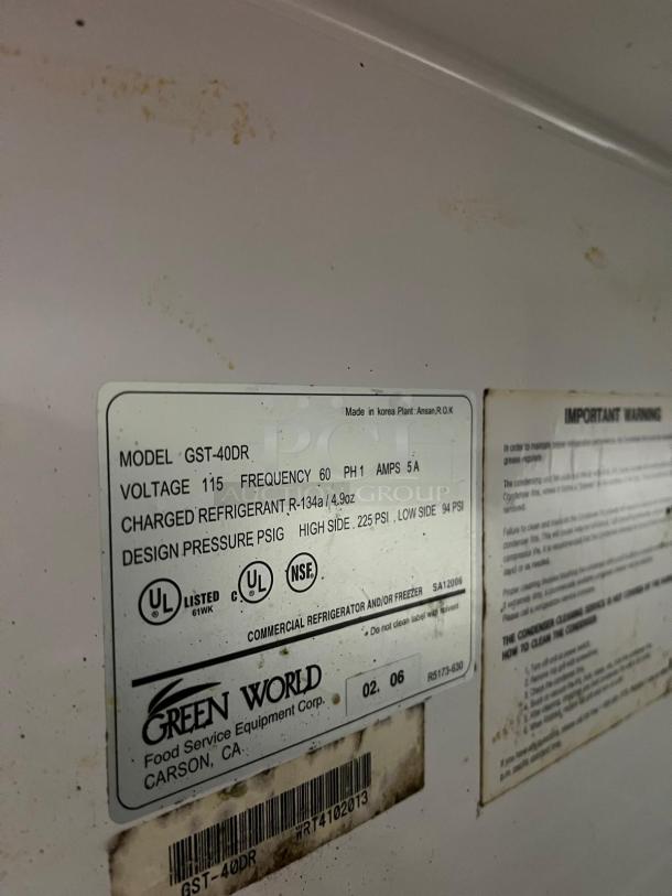 Green World GST-40DR commercial refrigerator label, showing model, voltage, and refrigerant details. Made in Korea by Turbo Air.