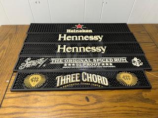 Bar runners featuring logos: Heineken, Hennessy, Sailor Jerry, Three Chord. Black rubber, good condition, brand logos distinct.