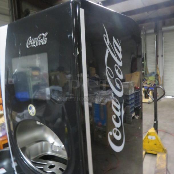 Pininfarina FREESTYLE soda dispenser, Model #FREESTYLE, black with Coca-Cola branding, dimensions 25x35x75, in used condition.