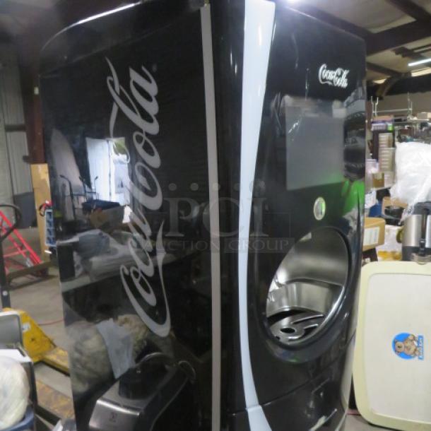 Pininfarina FREESTYLE soda dispenser, Coca-Cola branding, black exterior, model# 25X35X75, in good condition.